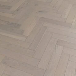 Liberty Floors Pebble Grey Oak - Herringbone Parquet 14mm Engineered Real Wood Flooring (219386) -Laminate Flooring Sales Store pebble grey oak herringbone parquet 14mm engineered real wood flooring 219386 p85834 201395 image